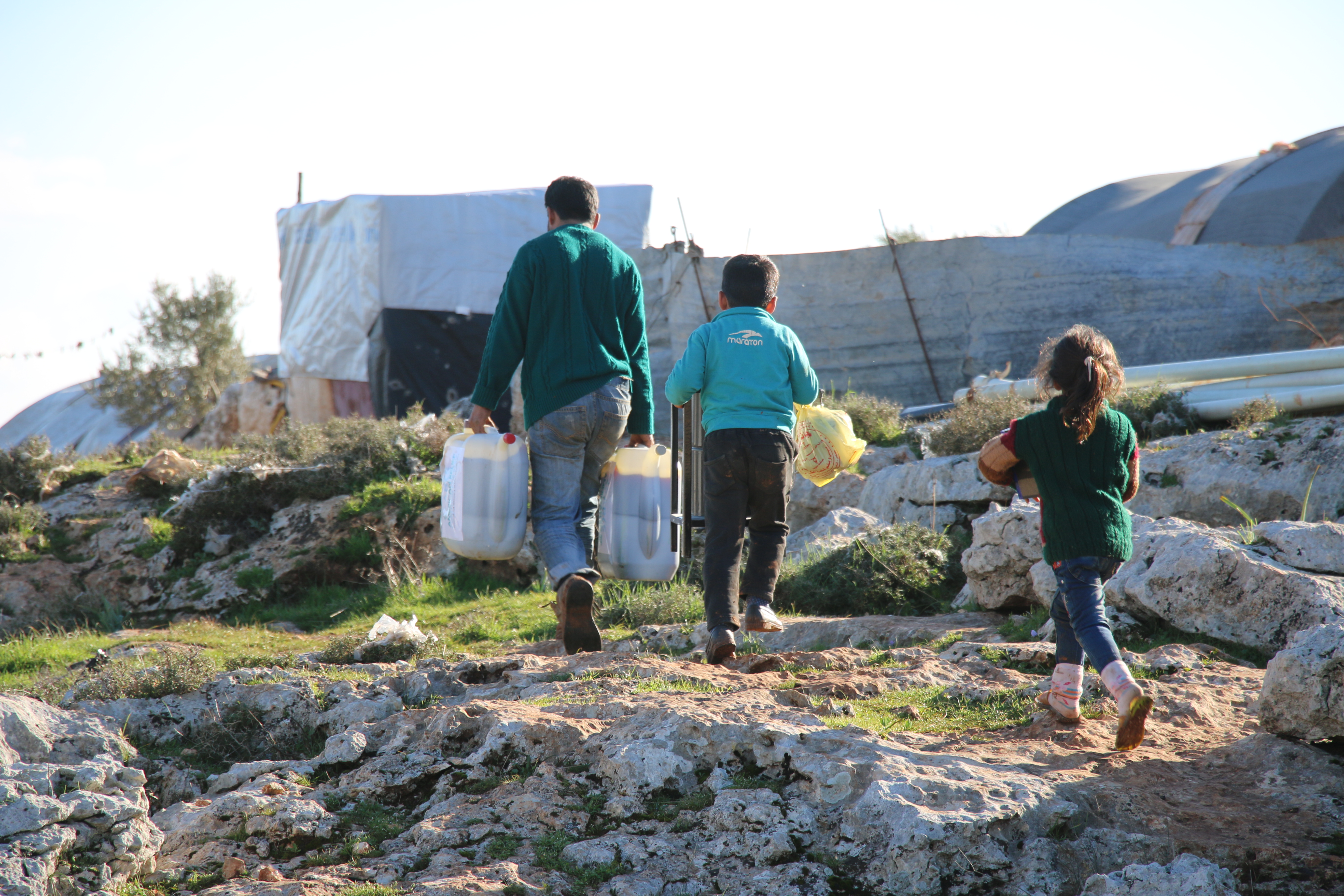 Children receiving supplies from ARCS flooding response